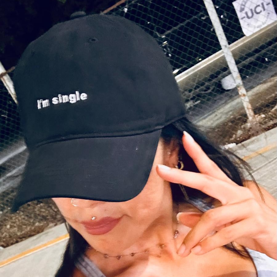 The I’m single hat, worn outdoors